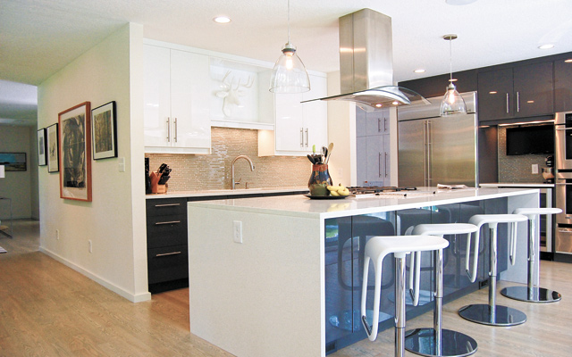 Opening up the kitchen as hub of both home and entertaining activities means more involvement and less isolation. Photo courtesy of Shelter