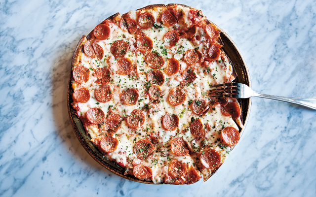 Simply good: Thin-crust Pepperoni Pizza is almost like a flatbread. Loved how it was heaped with gooey mozzarella, parmesan, and a tasty sauce. Photo by Hubert Bonnet