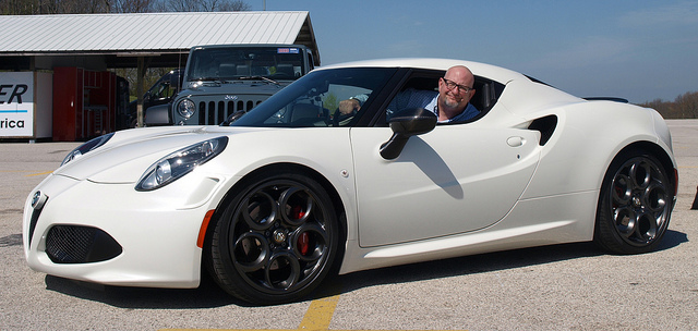 The author inside of a 2015 Alfa Romeo 4C - photo provided by Victory & Reseda for Lavender Magazine