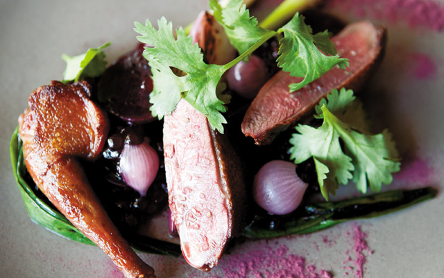 Roasted Squab—The look and fresh taste of spring. Beetroot pearls of tapioca, new onions, hibiscus with fresh roasted squab. Photo by Hubert Bonnet