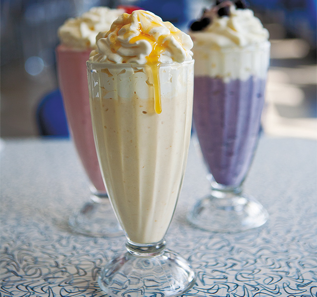 Strawberry and Blueberry Shakes backing up a supreme sweet: a Honey Caramel Malt. Photo by Hubert Bonnet