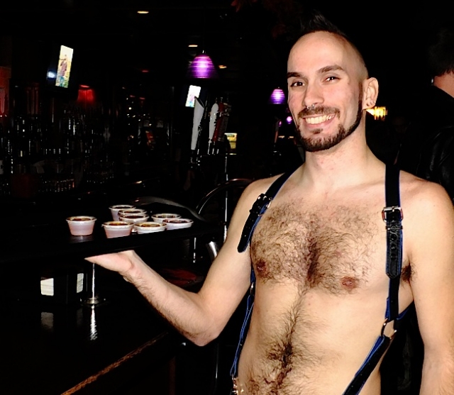 Contestant Ren Rushold selling Jello shots during the Friday night Greet-the-Meat event. Photo by Steve Lenius.