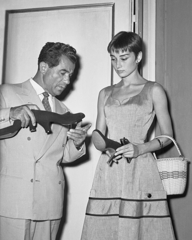 Salvatore Ferragamo with Audrey Hepburn at Palazzo Spini Feroni in Florence, 1954. © Banca Dati dell'Archivio Storico Foto Locchi Firenze