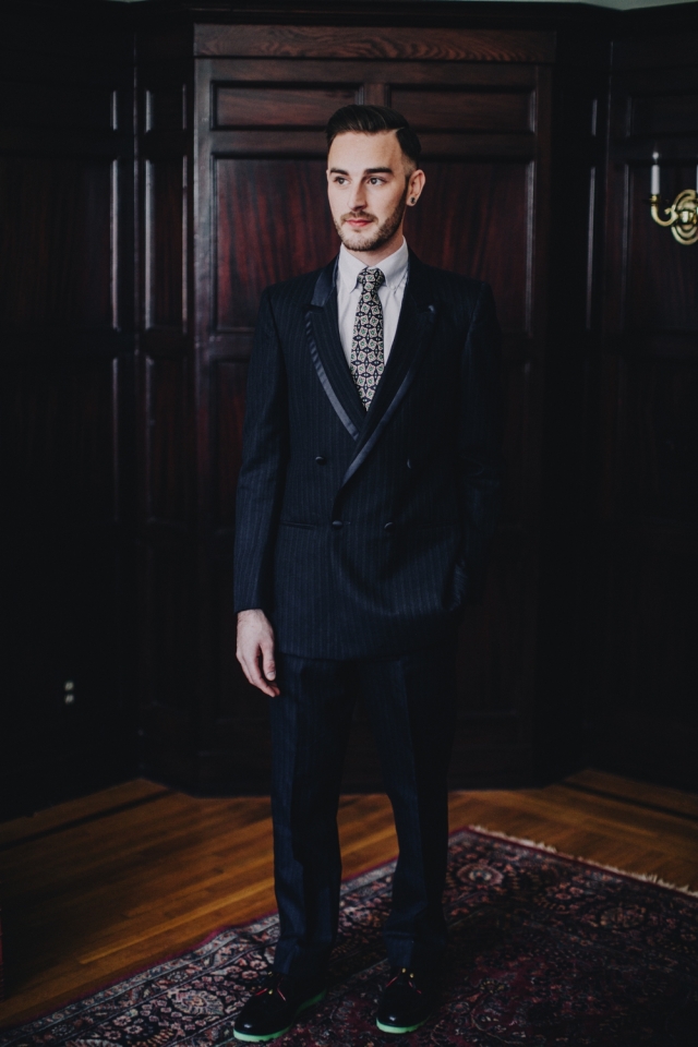 Custom upcycled double-breasted navy blue tuxedo with satin trim ($225) from Dapper Dan Michael; "Grown Man Solar Red" resoled Florsheim shoes with green glow bricklayer sole by Greenwich Vintage Co. Photography by Matt Lien Photography