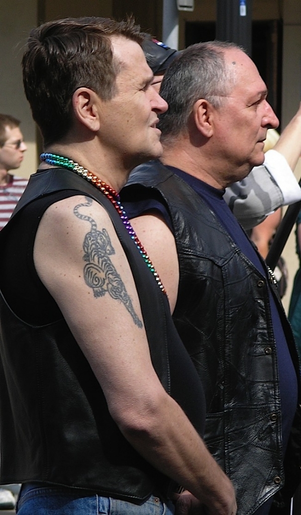 Colin Spriestersbach and Carl Gscheidmeier in 2008 at the retirement ceremony for the original leather pride flag. Photo by Bill Schlichting.