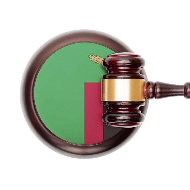 National Legal System Conceptual Series - Zambia Wooden judge gavel with national flag on sound block series - Zambia