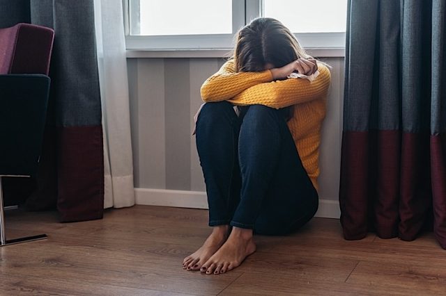 Domestic Abuse Woman At Home Photo courtesy of BigStock/AMJ Fotografia