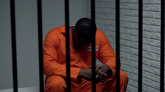 Pensive African-American Prisoner Waiting For Visitors, Serving Life Sentence Photo courtesy of BigStock/motortionjpg