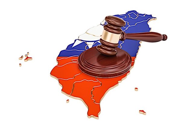 Wooden Gavel on map of Taiwan 3D rendering isolated on white background Photo courtesy of BigStock/AlexLMX