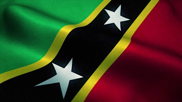 Saint Kitts And Nevis Flag Waving In The Wind. National Flag Of Saint Kitts And Nevis. Sign Of Saint Photo courtesy of BigStock/larich