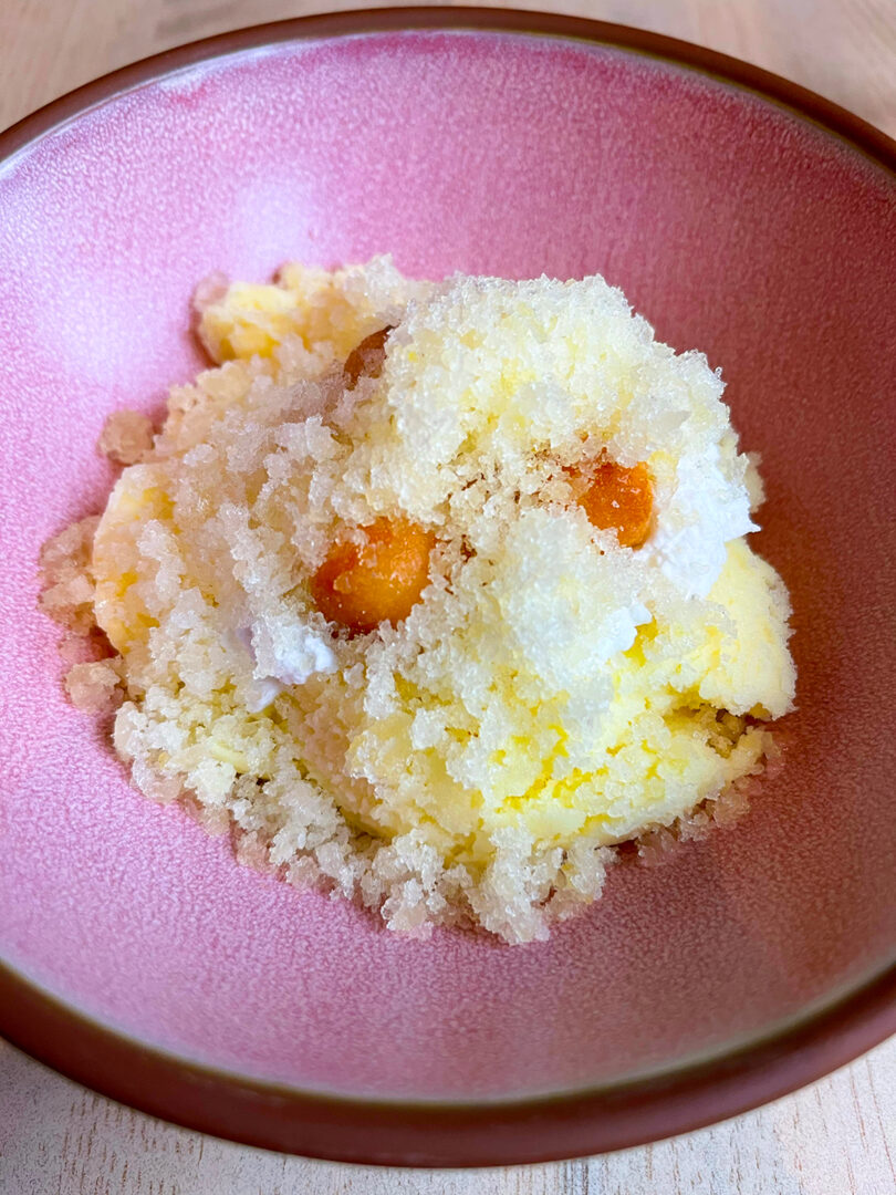 Pineapple & Passionfruit dessert in a bowl.