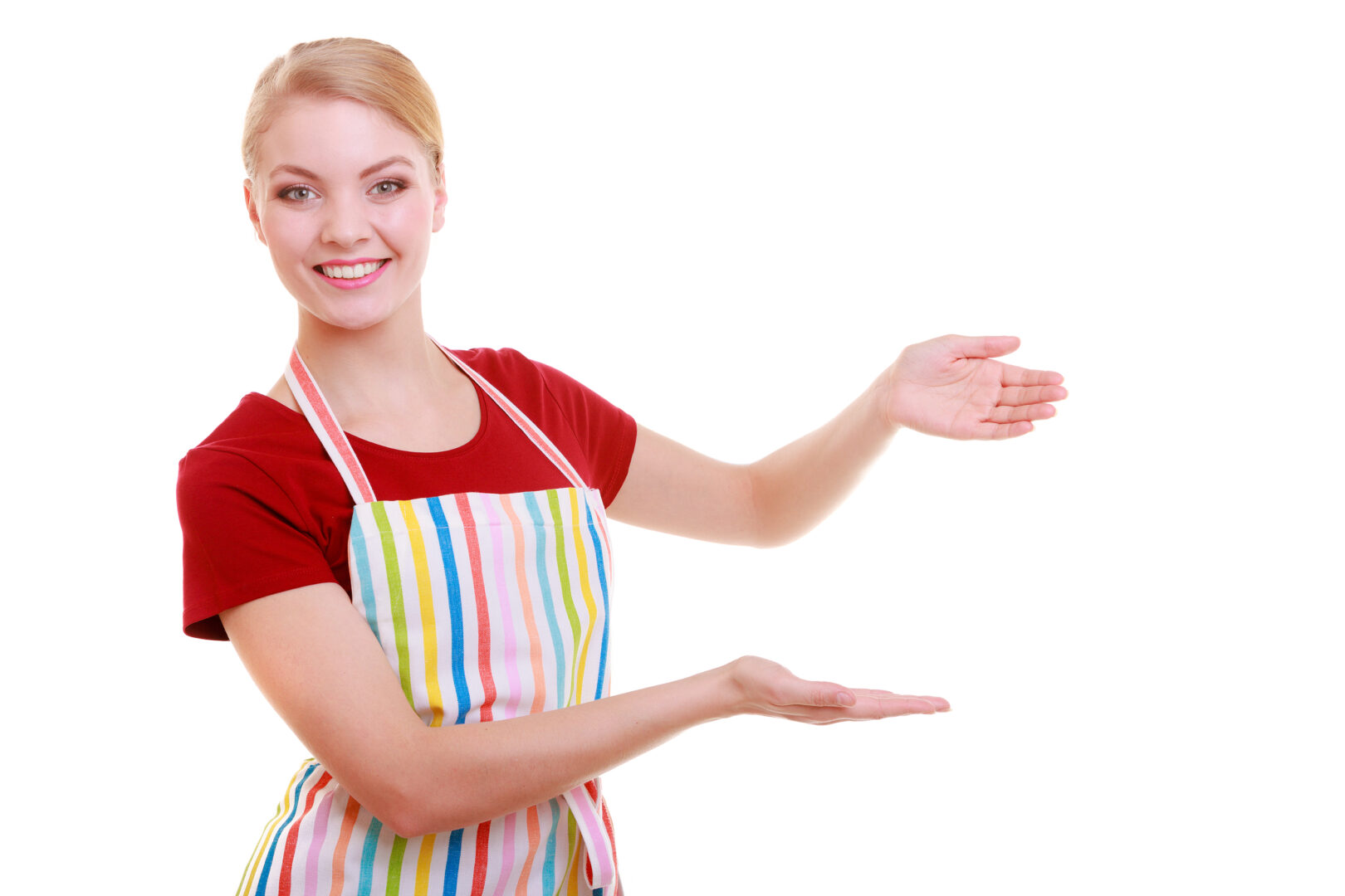 Smiling, welcoming woman with rainbow apron inviting people into her business.