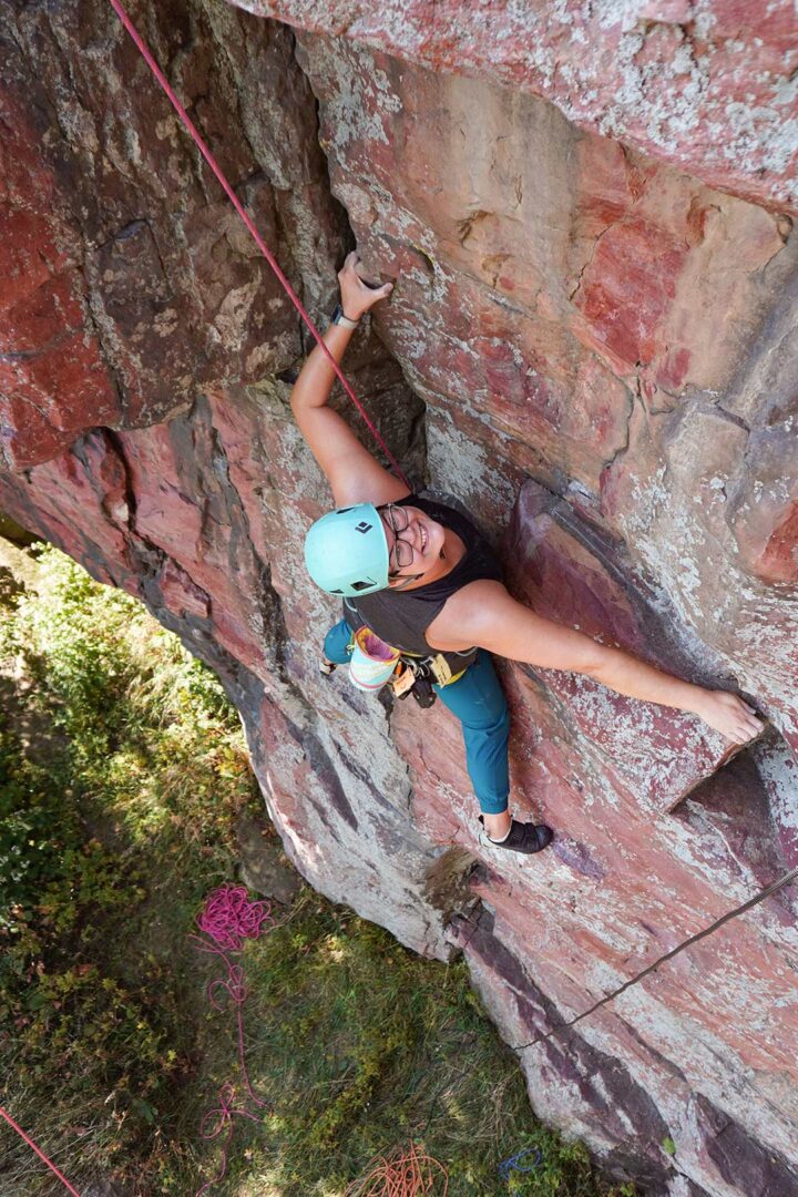 Nicole climbing rock at Blue Mounds.