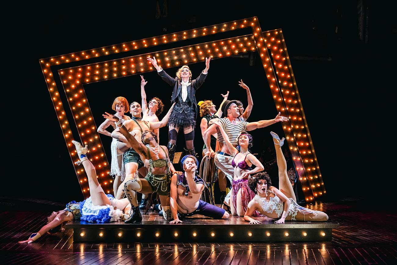 Cast of Cabaret on stage at the Guthrie posing for a promotional photo.