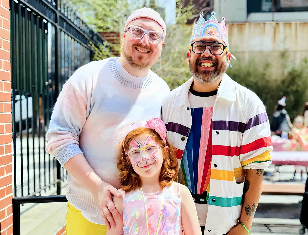 Gay fathers Joel and Yancy with their little girl.