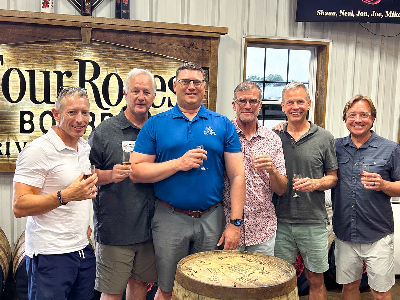Group shot of members of MACV and Four Roses Bourbon.