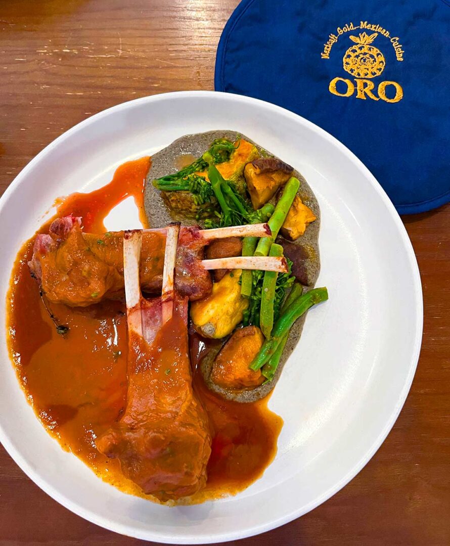 A plate of Barbacoa with veggies.