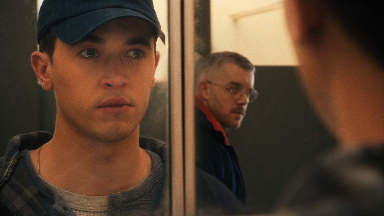 Production still of actors Tom Blyth and Russell Tovey in Plainclothes.
