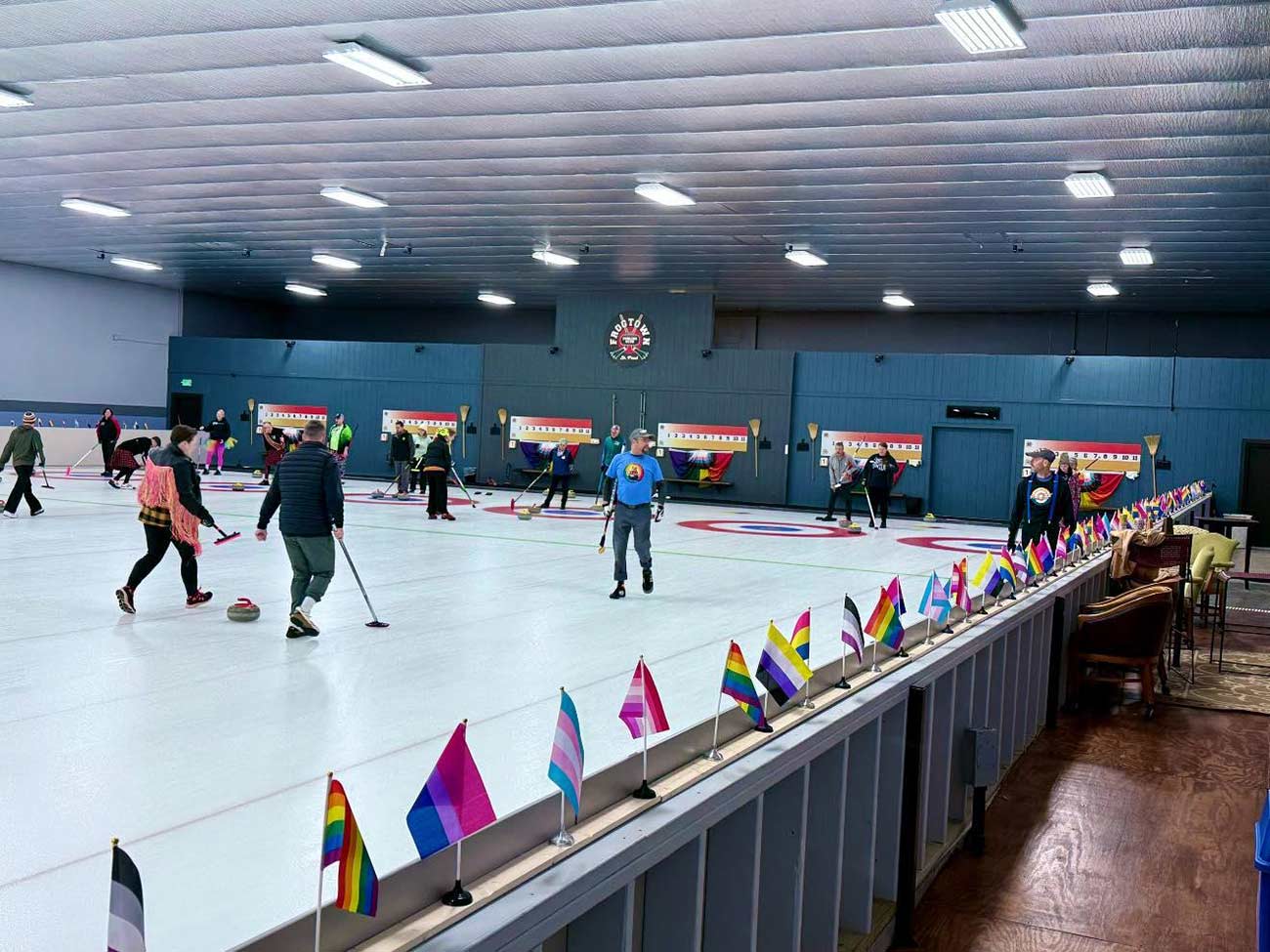 Frogtown Curling Club members out on the ice rink preparing to compete.