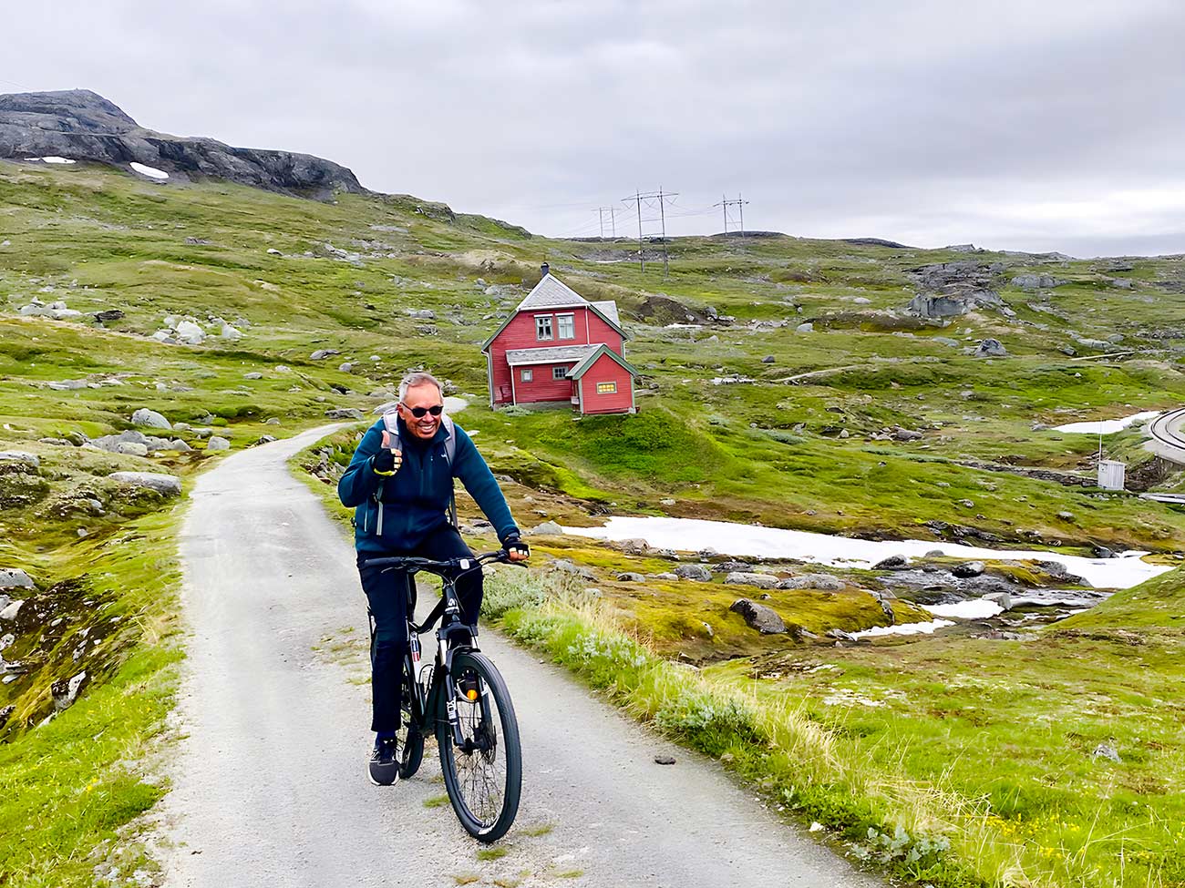Jim St. George bicycling through the hills near Finse, Norway.