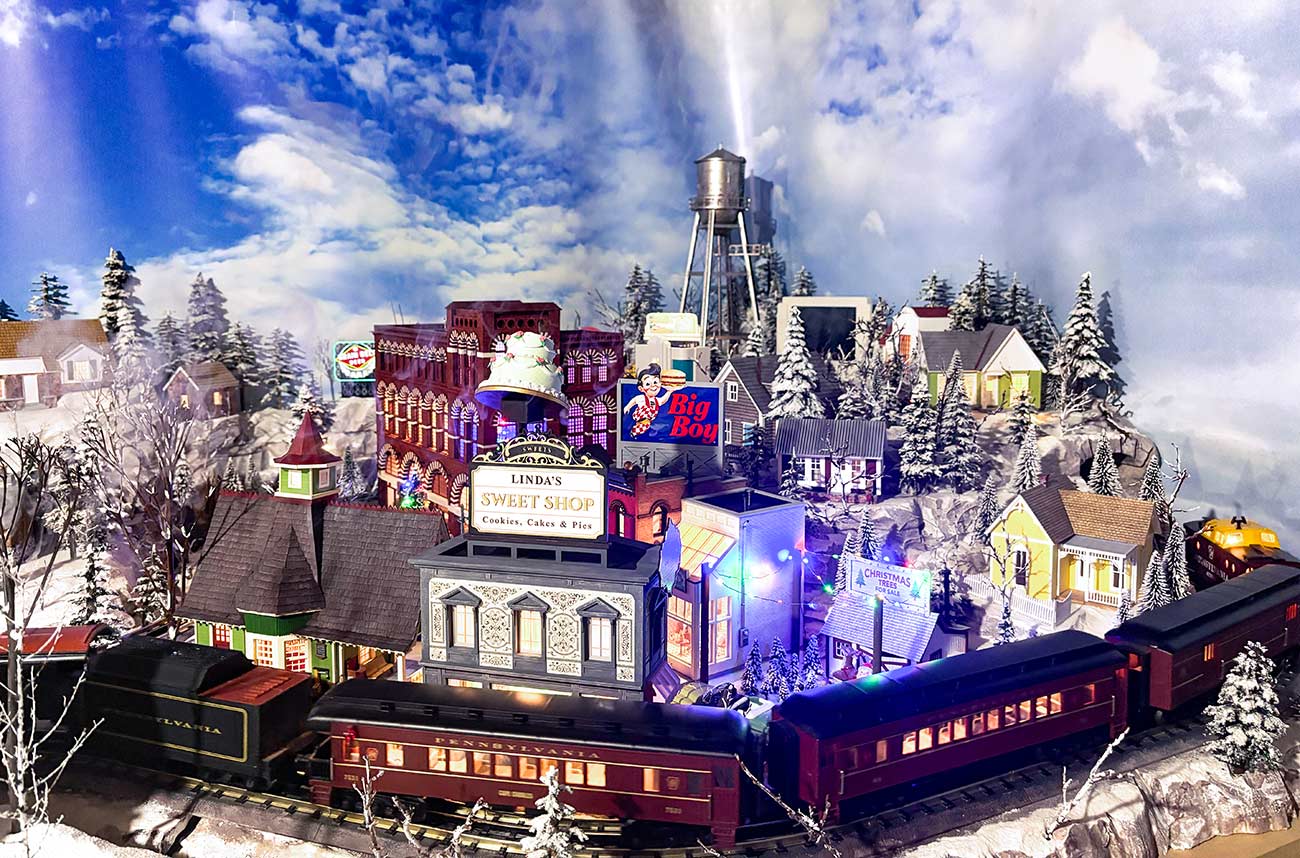 Close-up shot of homes and businesses in the Christmas Village display.