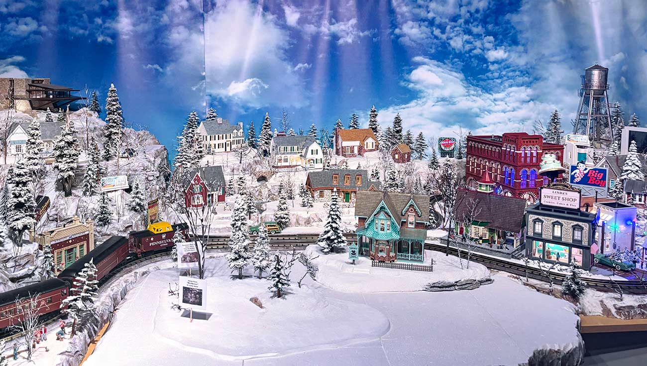 Close-up shot of homes and businesses in the Christmas Village display.