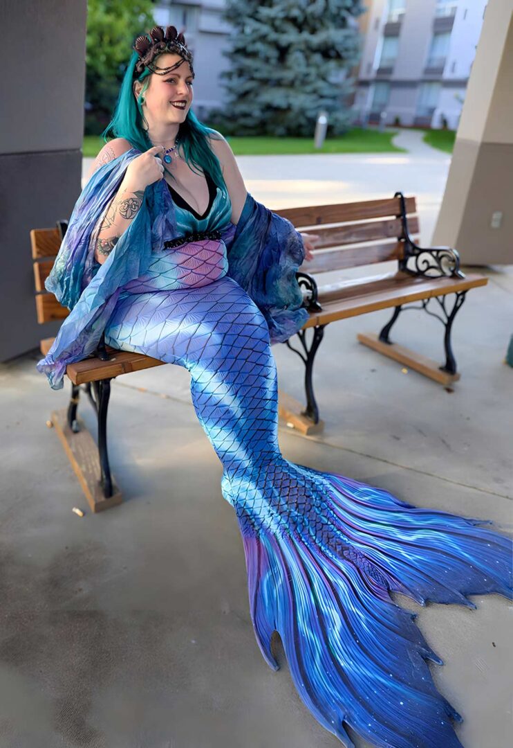 Rachel wearing her blue and purple mermaid costume outside her hotel.