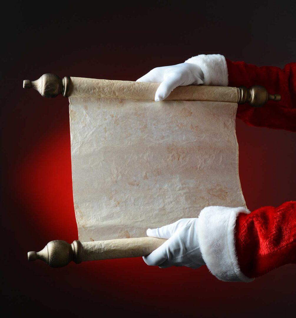 Santa Claus holding his naughty and nice list over a light to dark red background.
