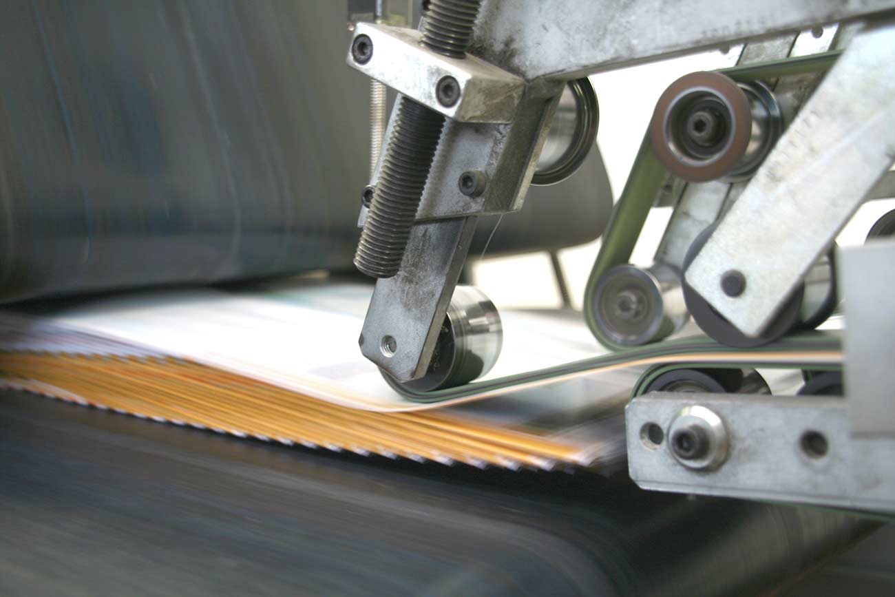 Working typography machine close up with brochures.