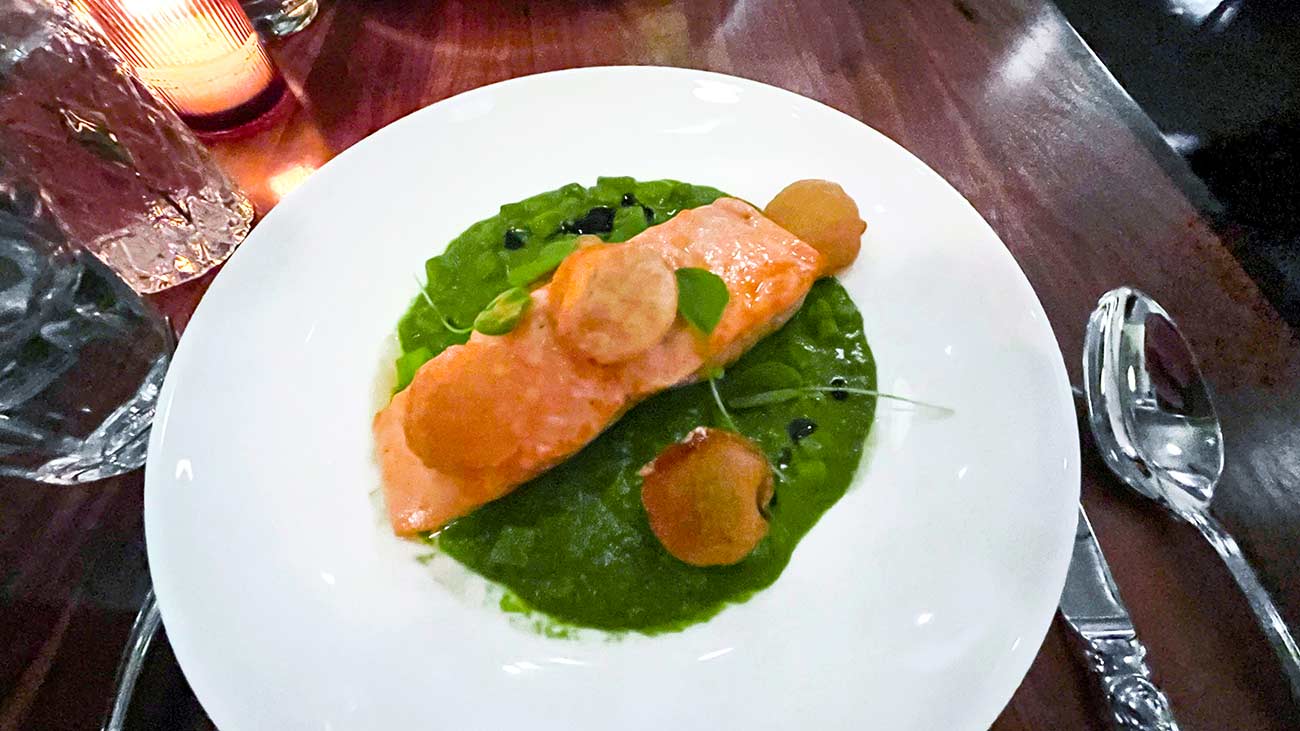 Poached Salmon withchaudre française, clams, braised potatoes, watercress.