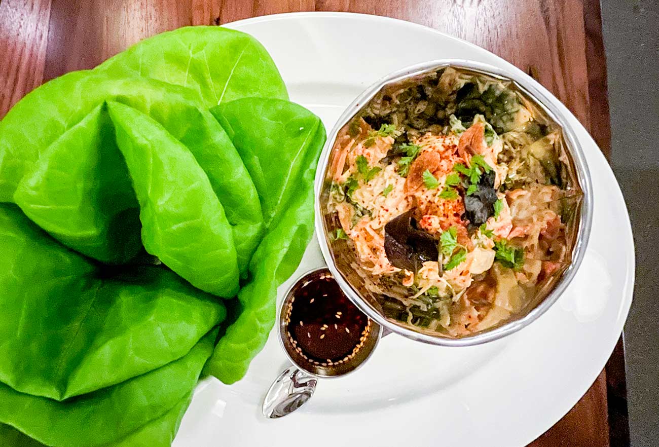 Snow Crab Lettuce Cups with hearts of palm, carrot mayo, cilantro.