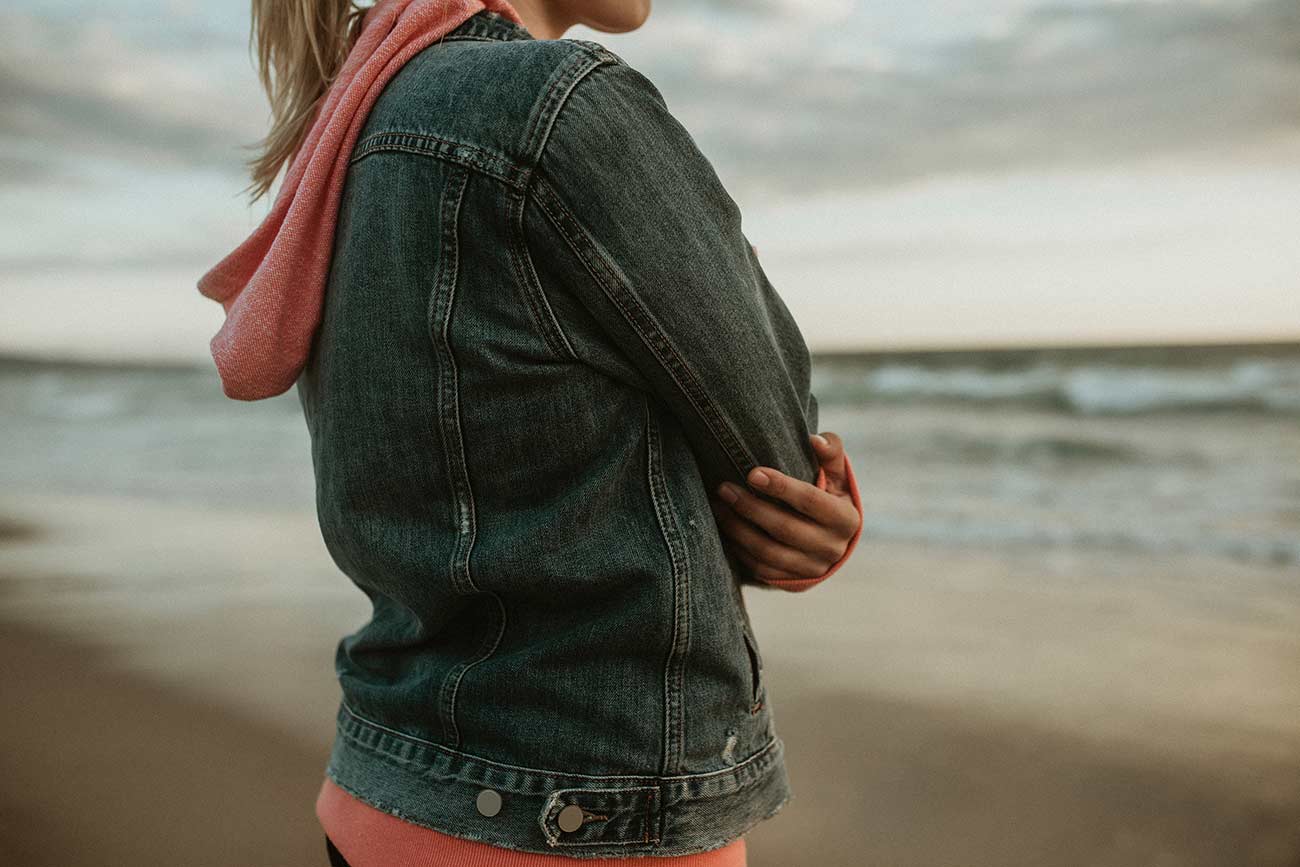 Woman on a gloomy beach.