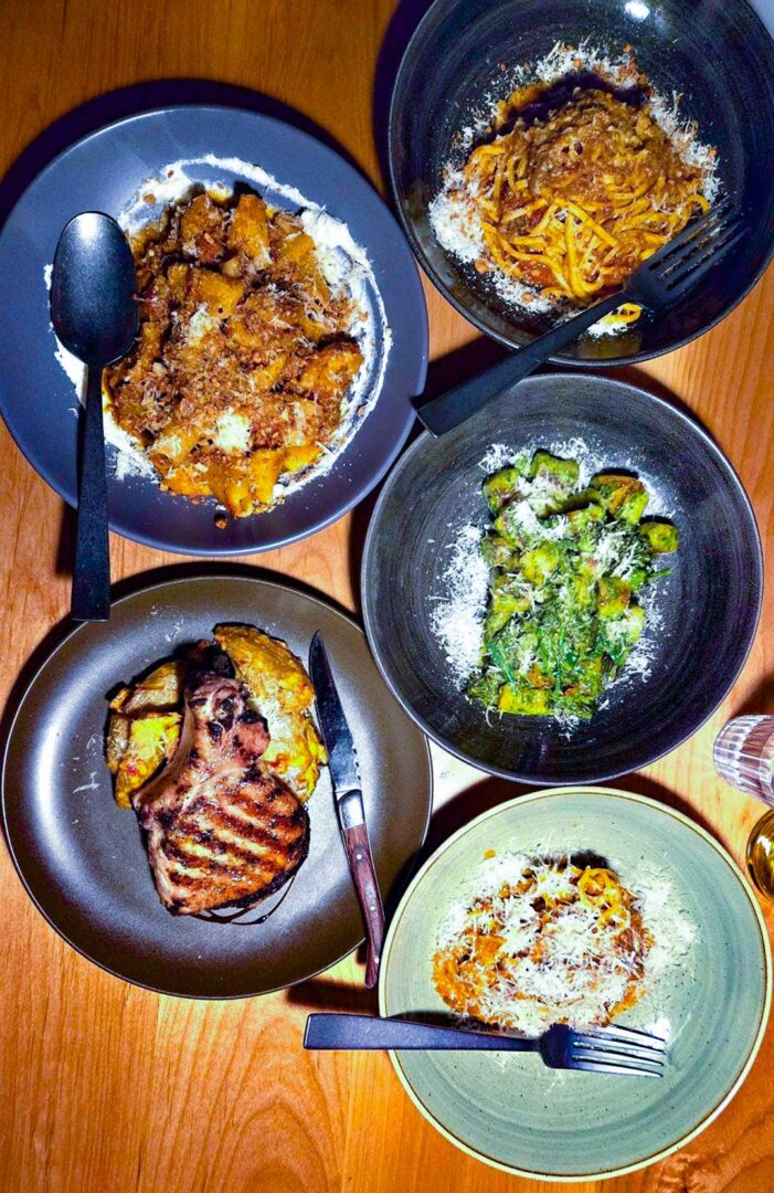 Five plates of food served at Passatempo Taverna.