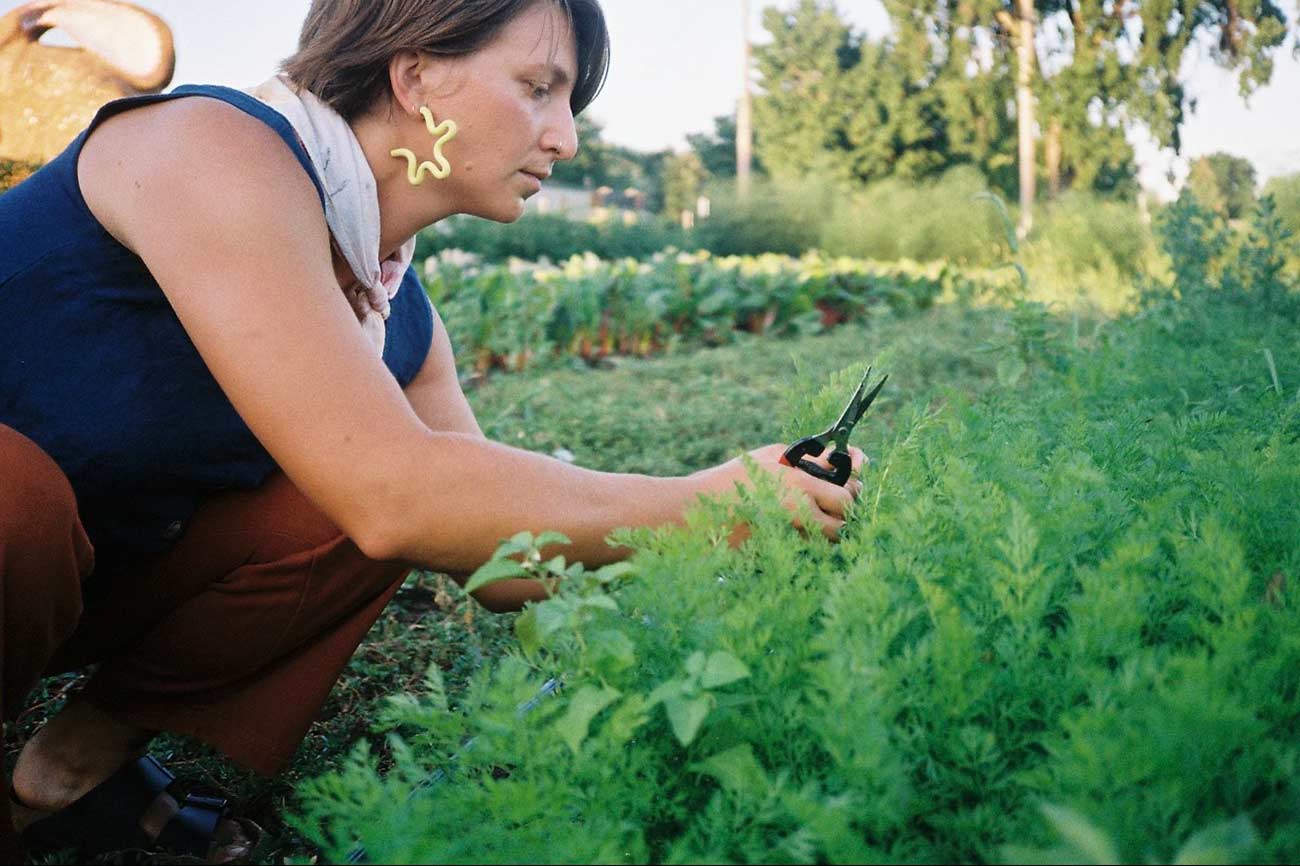 Close-up shot of Elyssa gardening.