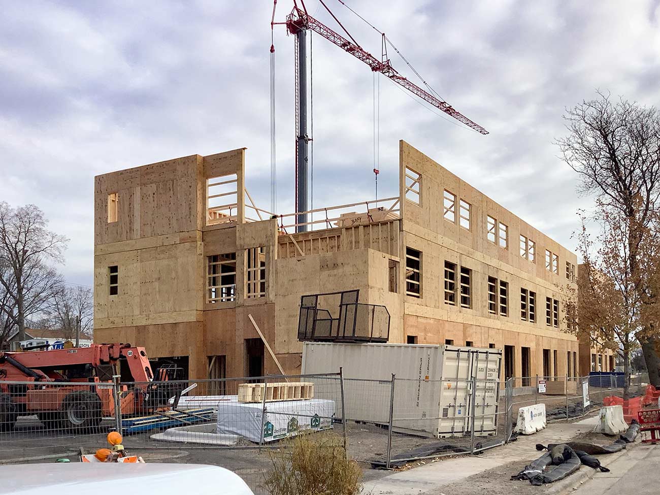 Exterior shot of the wood framing for the Avenues for Youth center.