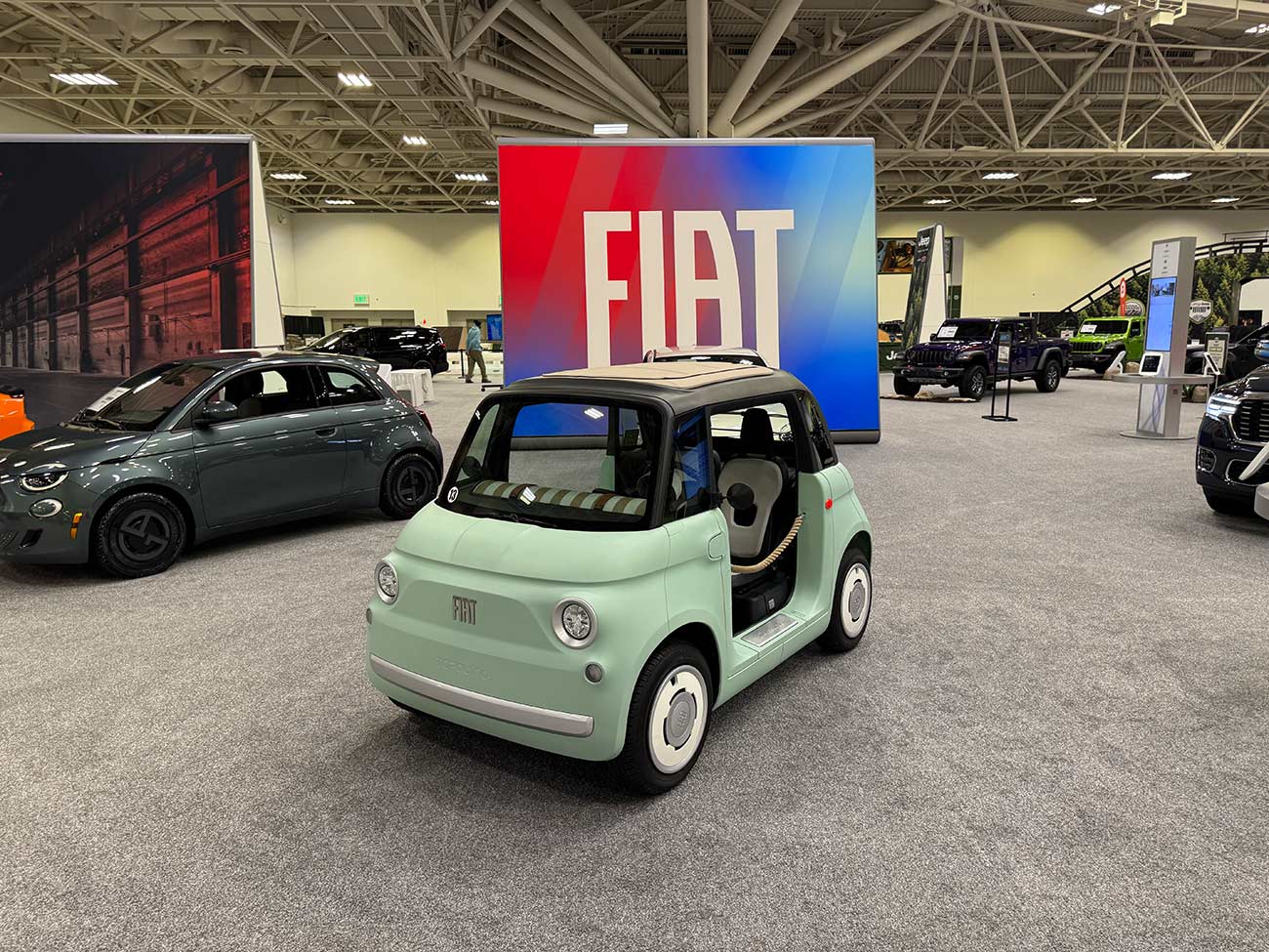Front view of the Fiat Topolino at an auto show.