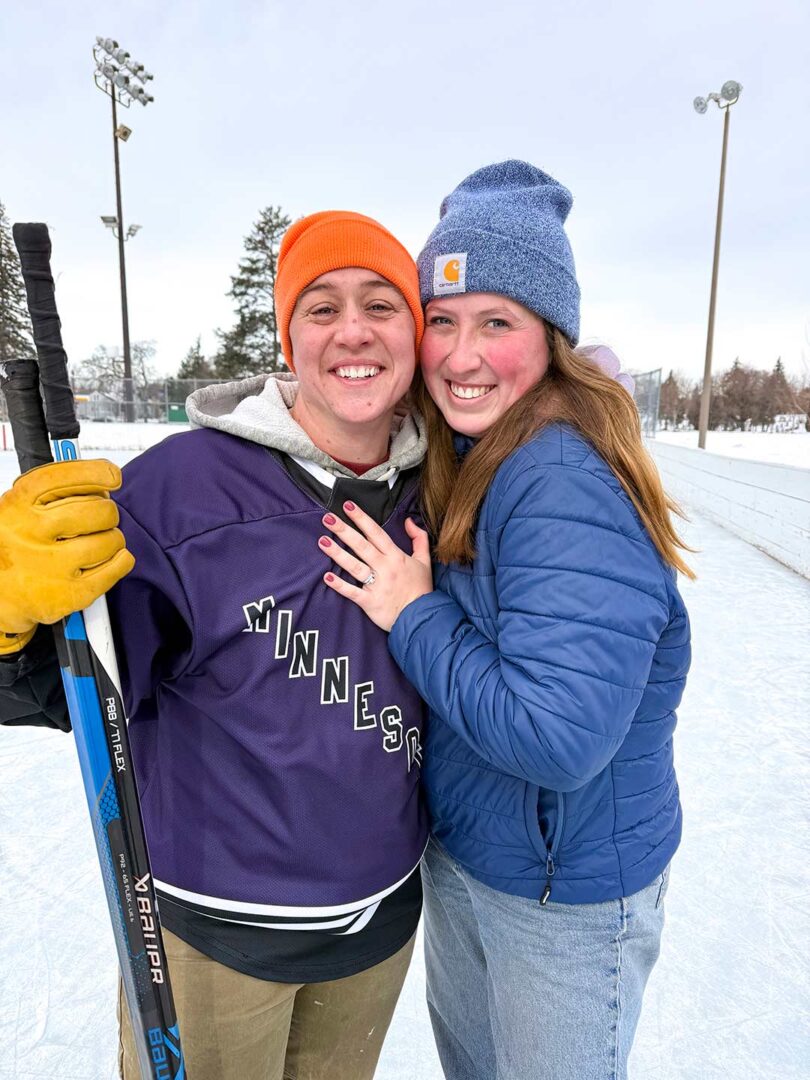 Claire Mathews-Lingen and Minneapolis Queer Hockey Founder Erin Melzer, engaged on the ice.