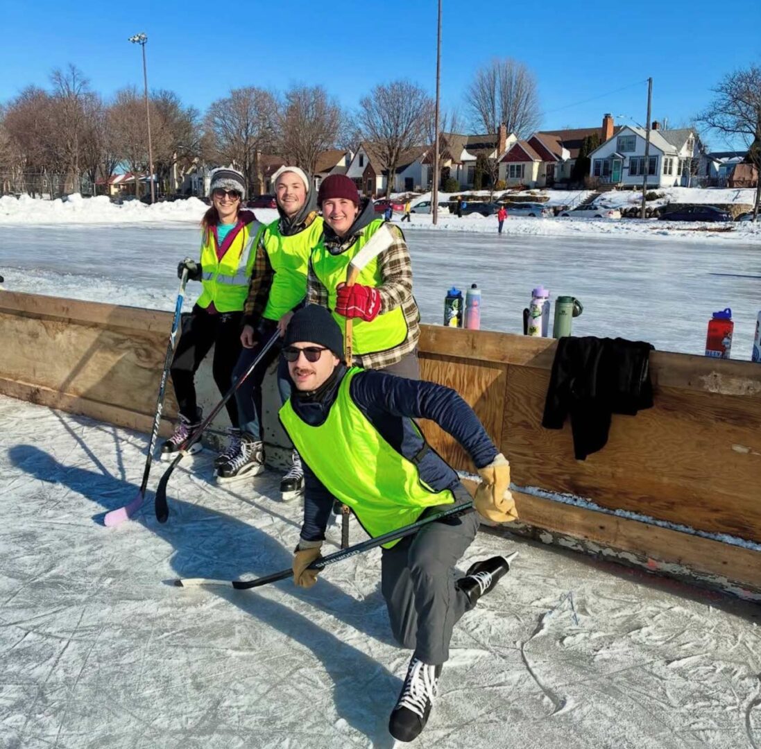 Four teammates in high-vis on the boards.