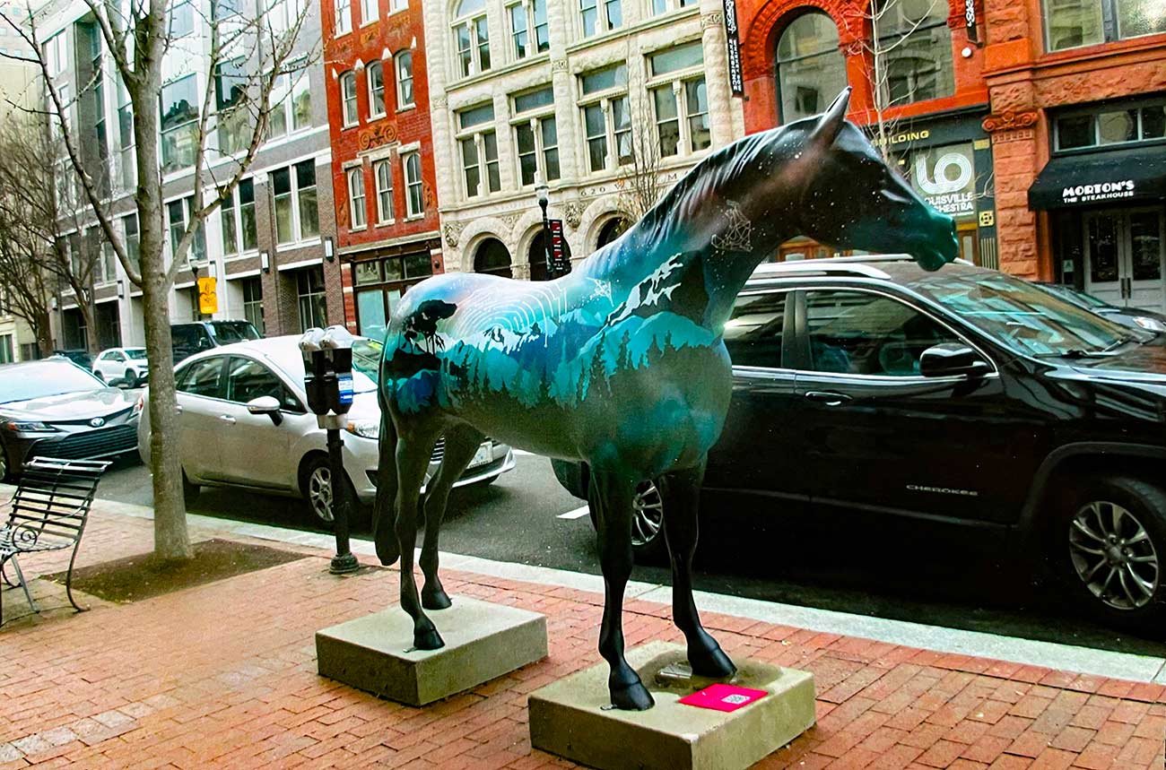 Horse statue along the sidewalk in downtown Louisville Main Street.