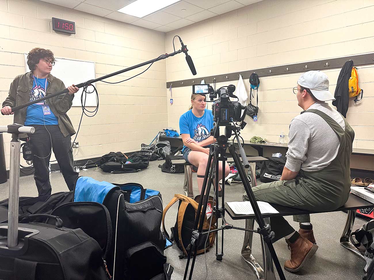 Quiet On The Ice filmmakers conducting an interview in a behind-the-scenes shot.