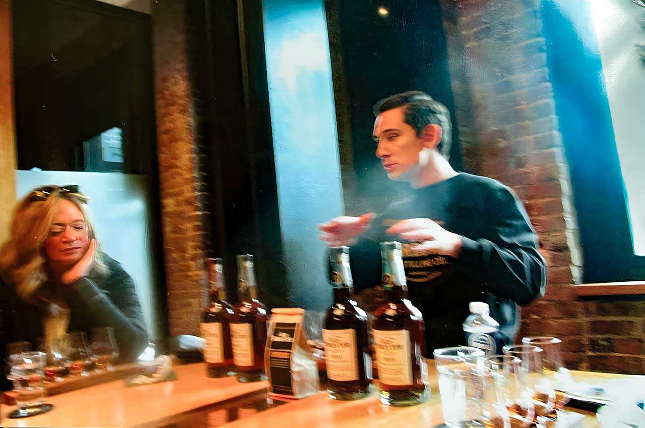 A man demonstrating different whiskey's during a tasting experience at the Old Forester Distilling Co.