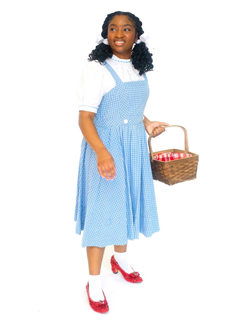 Actress Aniya Bostick dressed as Dorothy from The Wizard of Oz.