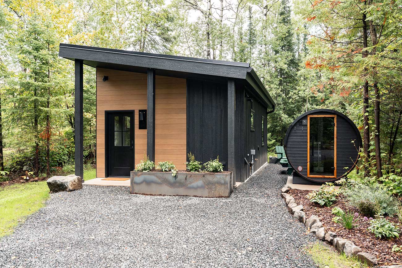 Wildernest Cabin with an outdoor sauna next to it.