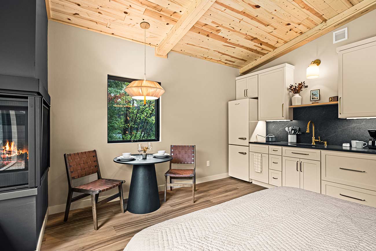 Cabin interior showing the kitchen and small dining area.