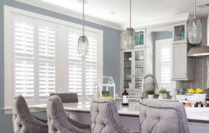 Modern kitchen showcasing white window shutters.
