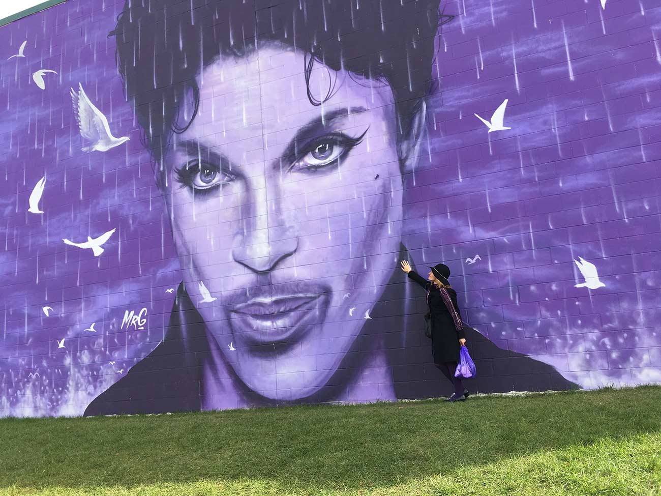 Emma Balázs adores a Prince mural painted on the side of a building.