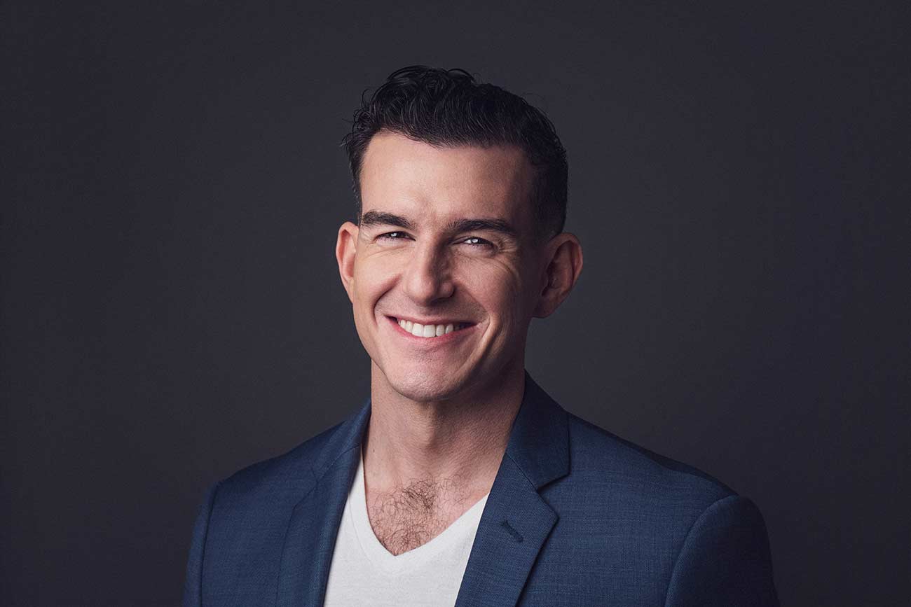 Headshot of Nicholas Wolny smiling.