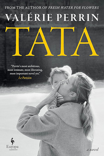 The cover of Tata that features a black and white photo of a woman kissing her hand holding her young child.