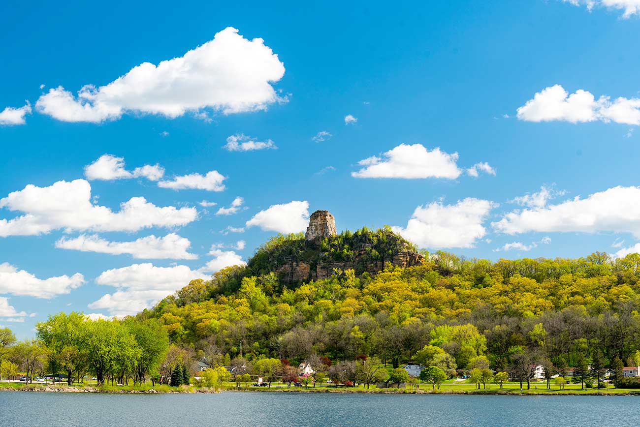 Sugar Loaf Bluff against brilliant skies in Winona Minnesota.