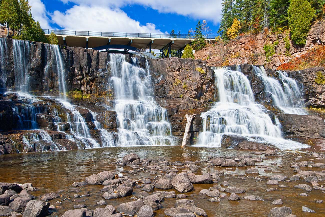 Highway 61 over middle gooseberry falls which is one of a number of falls on the gooseberry river that eventually enters into lake superior.
